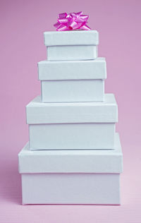 Close-up of pink stack over white background