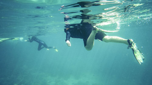 People swimming in sea