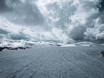 Scenic view of snowcapped mountains against sky