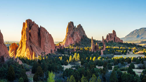 Panoramic view of rocks and mountains against clear sky