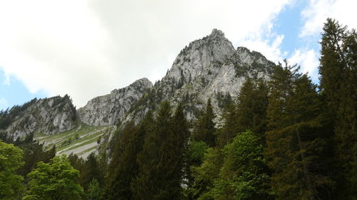 Low angle view of mountain range against sky