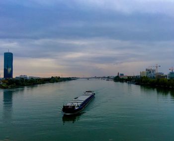 Boat in city against sky