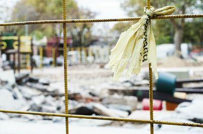 Close-up of chain hanging on rope