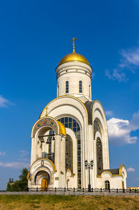 Low angle view of building against blue sky