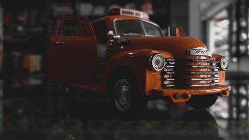 Close-up of vintage car on street