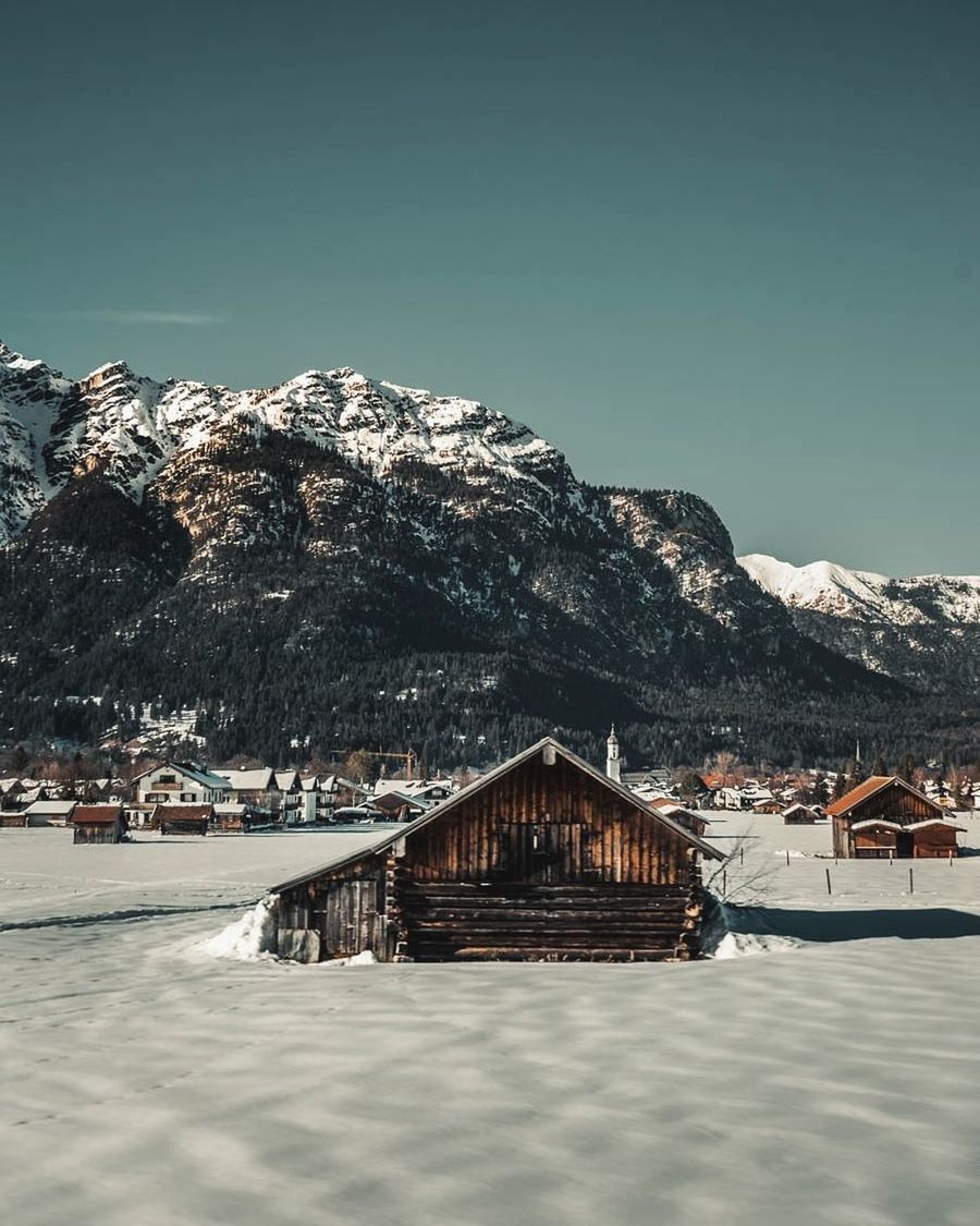 mountain, built structure, sky, winter, architecture, snow, cold temperature, building exterior, nature, beauty in nature, scenics - nature, building, clear sky, house, day, water, no people, mountain range, snowcapped mountain, outdoors, cottage