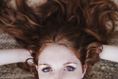 Portrait of young woman lying down