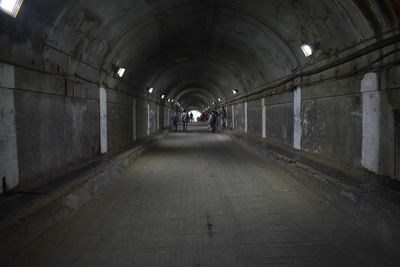 People walking in tunnel