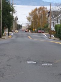 Road in city against sky