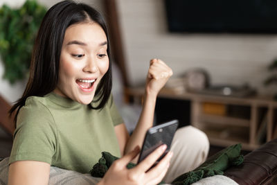 Young woman using mobile phone