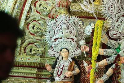 Low angle view of statue against temple