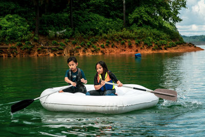 People on boat in lake