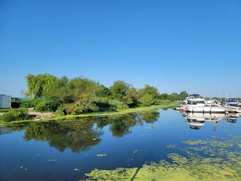 Boats on the water by the beach in pickering, ontario, canada