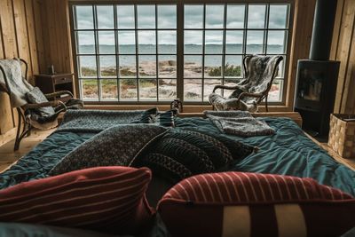 View of messy bed in bedroom