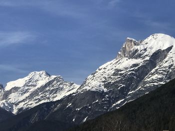 Scenic view of snowcapped mountains against sky