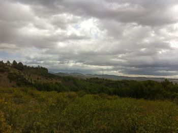 Scenic view of landscape against cloudy sky