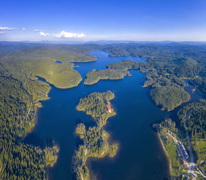 Aerial view of lake against blue sky