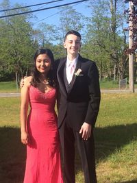 Portrait of smiling young couple standing in park