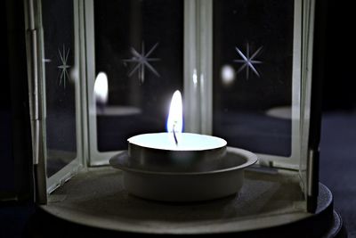 Close-up of illuminated candle