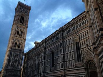 Low angle view of clock tower against sky