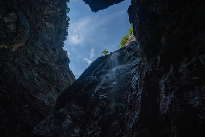 Low angle view of rock formation against sky