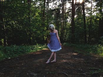 Full length of woman in forest