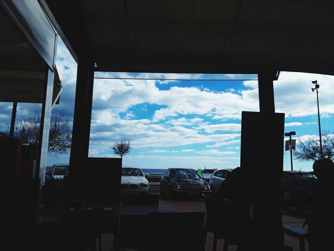 VIEW OF SKY SEEN THROUGH GLASS WINDOW