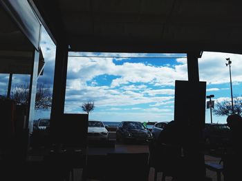 Cloudy sky seen through glass window