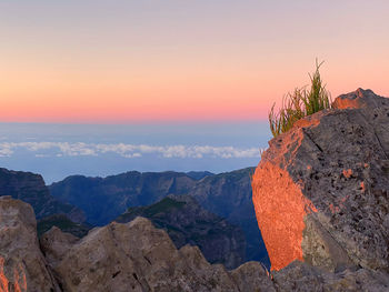 Scenic view of mountains against sky during sunset