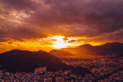 Cityscape against sky during sunset