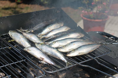High angle view of meat on barbecue