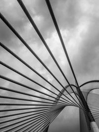 Black and white photograph of the bridge's metal bars.  bottom view