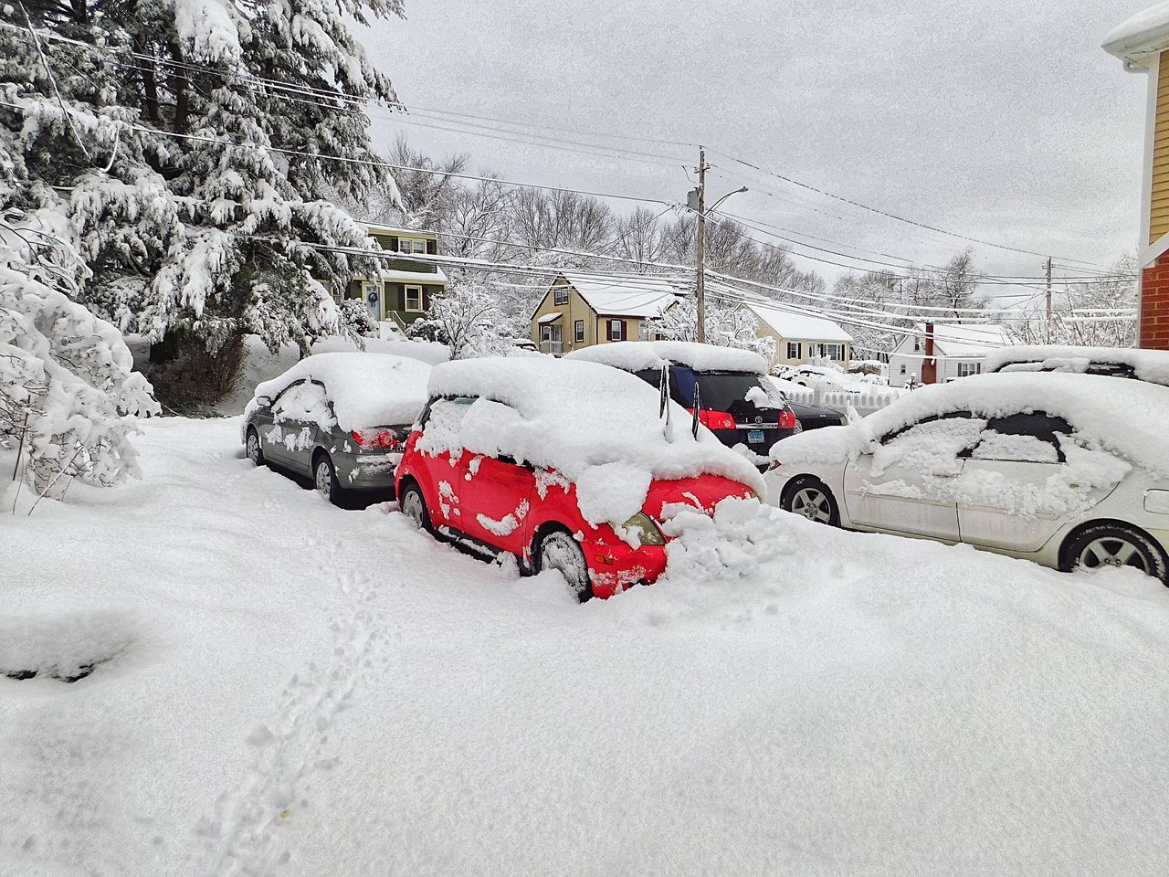 SNOW COVERED CAR ON STREET