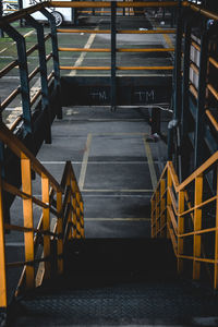 Empty chairs and tables in staircase