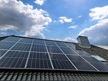 Solar panels producing clean energy on a roof of a residential house