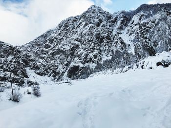 Scenic view of snowcapped mountains against sky