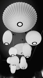 Low angle view of illuminated lanterns hanging from ceiling