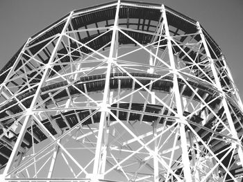 Low angle view of ferris wheel against sky