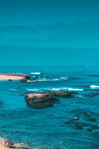 Scenic view of sea against blue sky