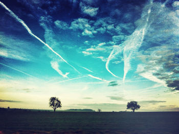 Scenic view of landscape against cloudy sky