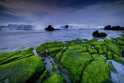 Panoramic shot of rocks on land against sky