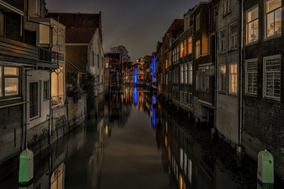 Reflection of houses in canal