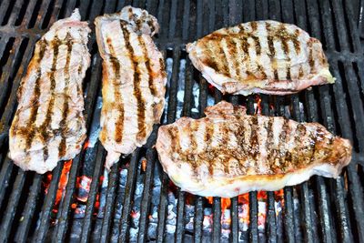 High angle view of steak on barbecue