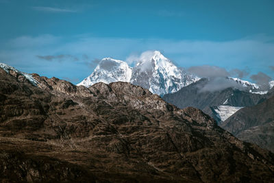 Scenic view of snowcapped mountains against sky