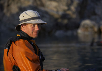 Portrait of man on a sea kayak in eastern greenland