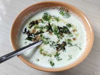 A top view photograph of coconut chutney to eat with idali sambhar.