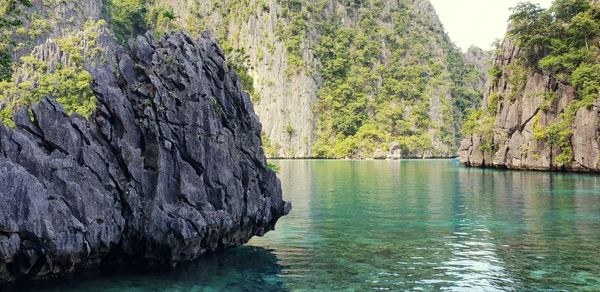 Scenic view of river amidst rocks