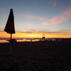 Scenic view of beach against sky during sunset