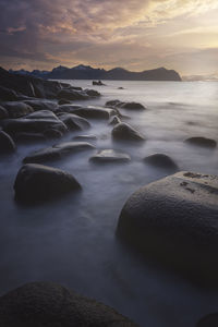 Rocks and water in vareid beach in lofoten