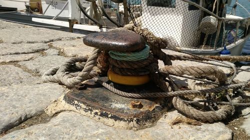 Close-up of rope tied to bollard